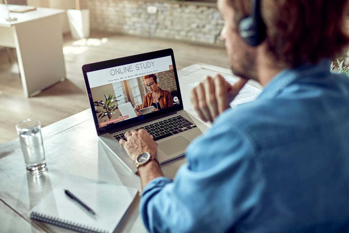 A man attending an online course