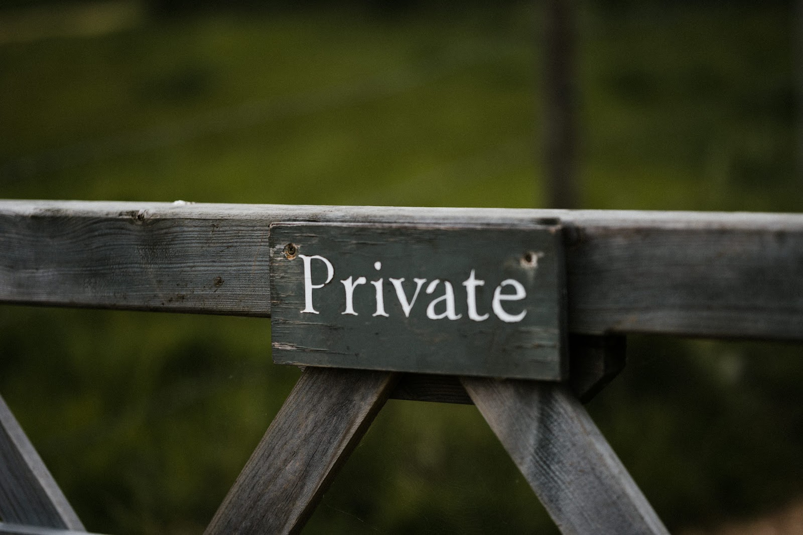 Gray wooden PRIVATE sign